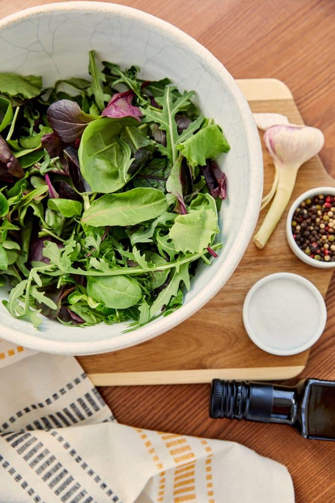 Fresh arugula leaves in a bowl
