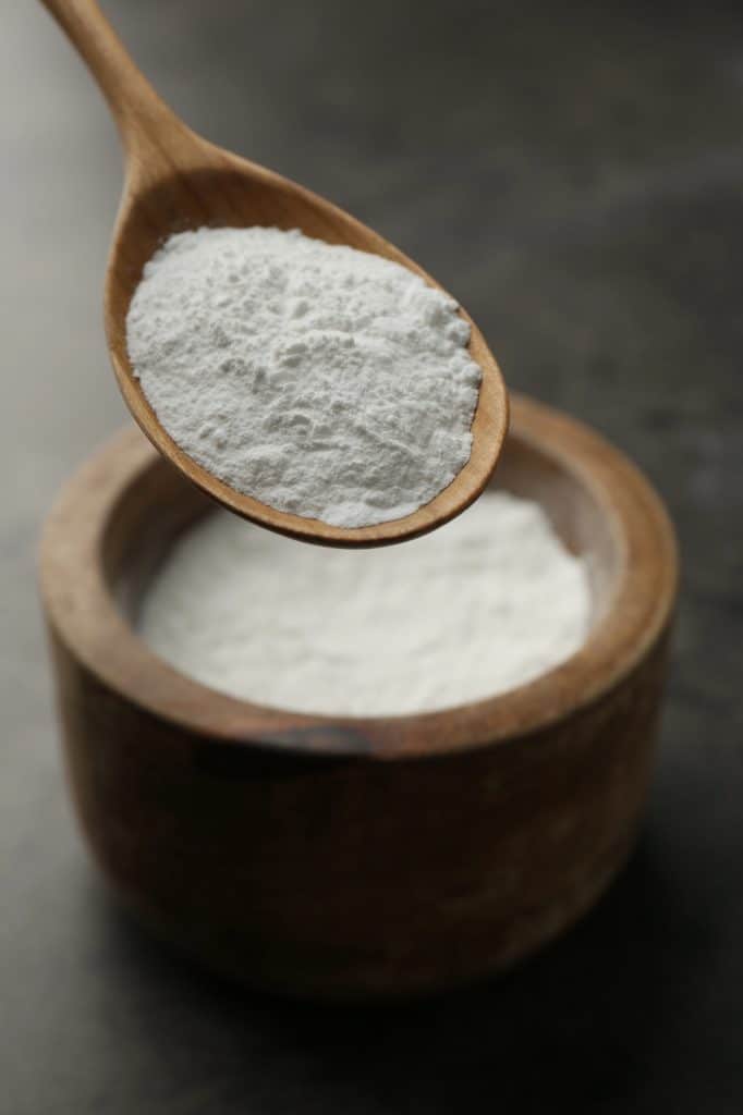 Container of baking powder on a kitchen counter