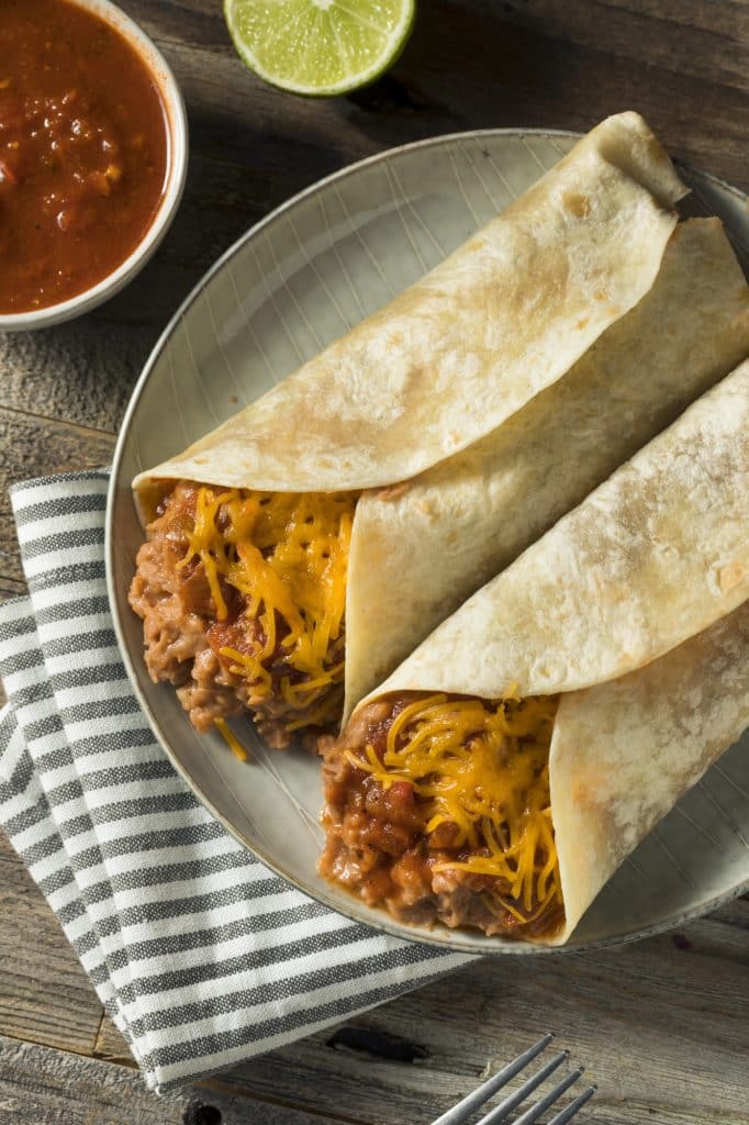 Bean and cheese burritos on a plate