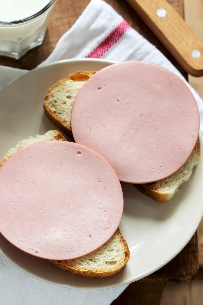 A fried bologna sandwich on white bread