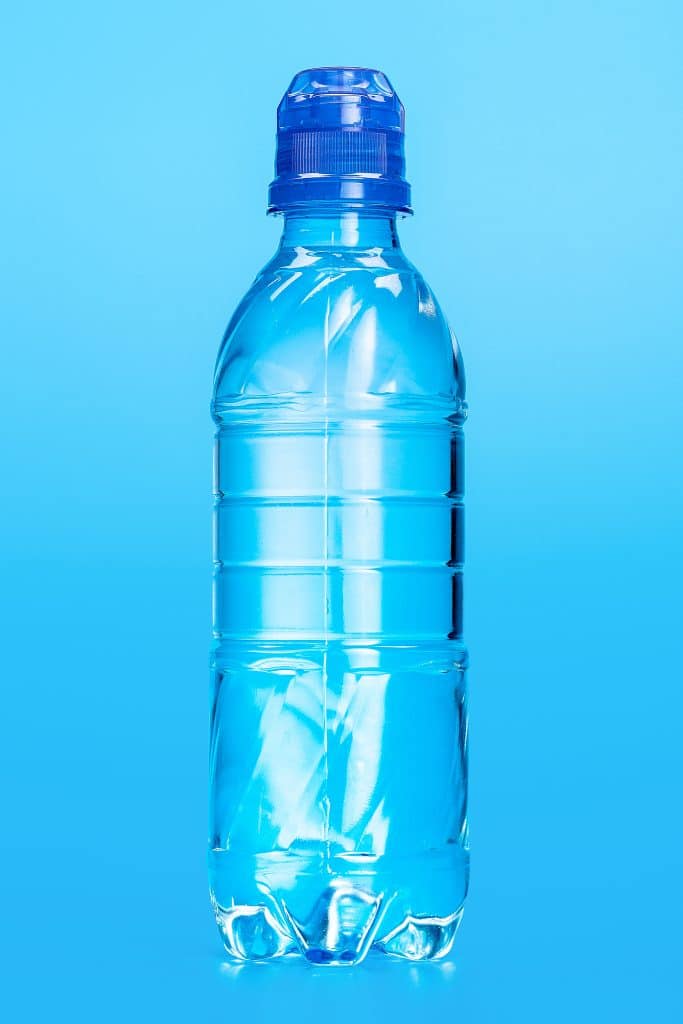 bottle of clean water against a blue background
