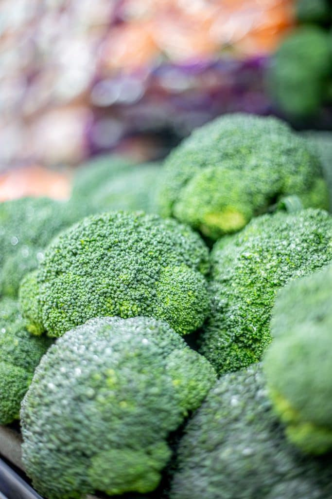 Fresh green broccoli crowns filling the frame