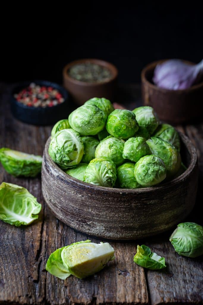 Fresh whole brussels sprouts on a countertop