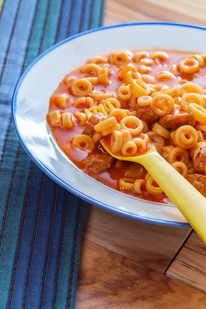Canned ravioli in tomato sauce in a bowl