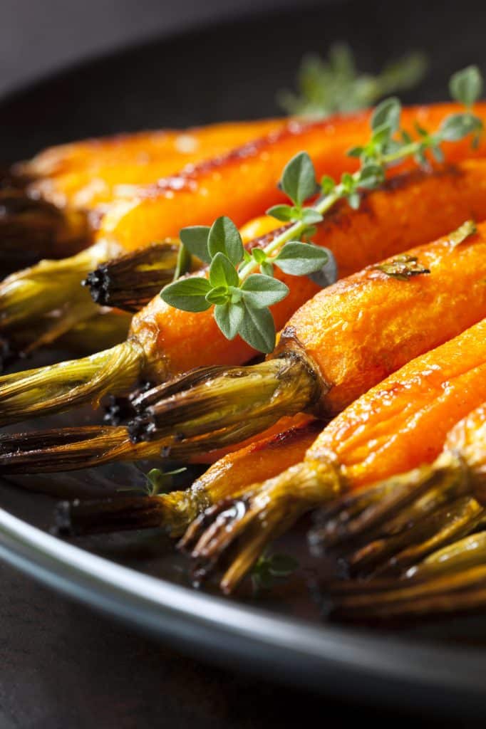 Whole carrots arranged in a row