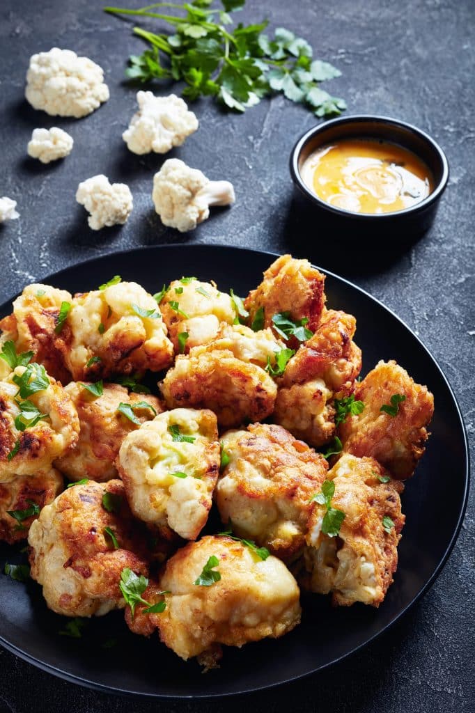 A head of cauliflower on a countertop