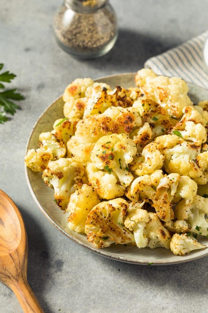 Whole cauliflower head on a kitchen surface