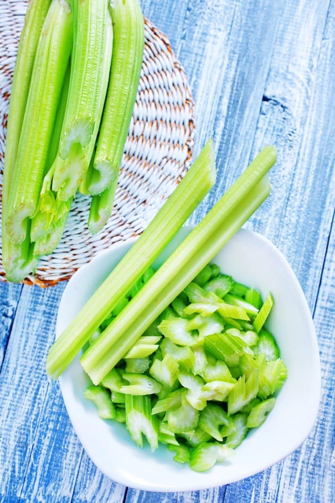 Stalks of celery with leafy tops