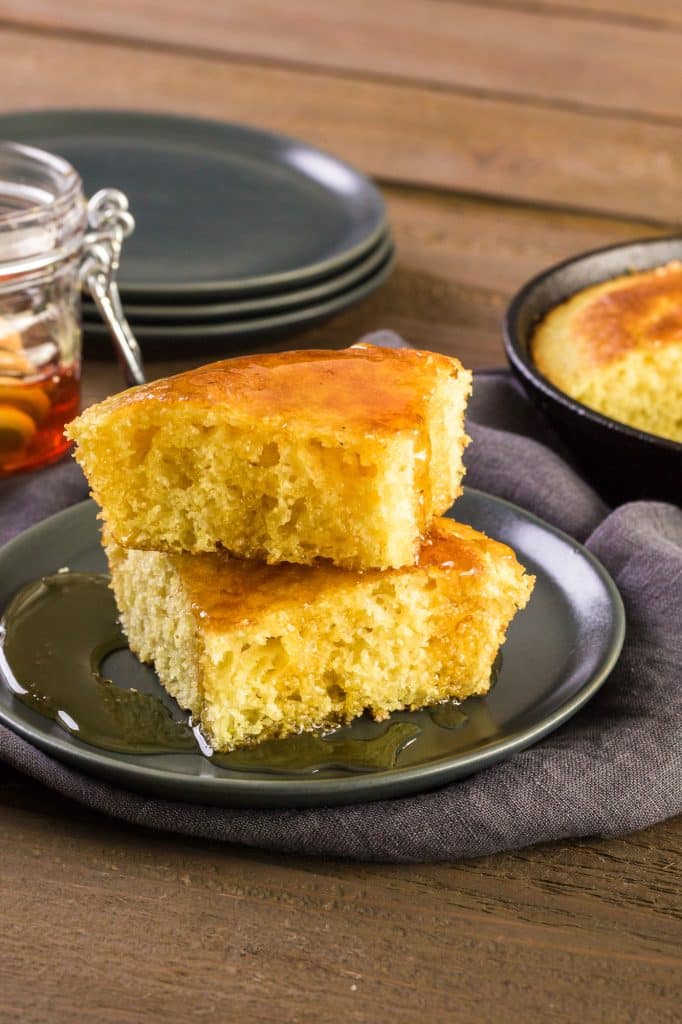 Golden cornbread with a slice cut