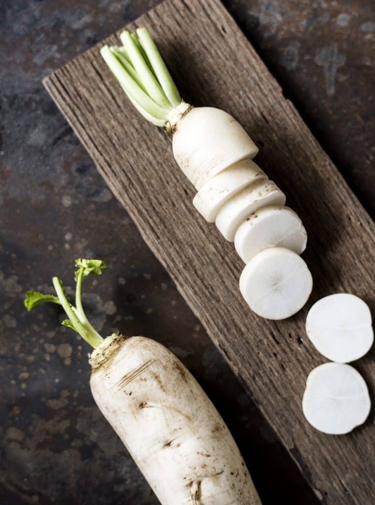 Cut daikon radish viewed from above on a cutting board
