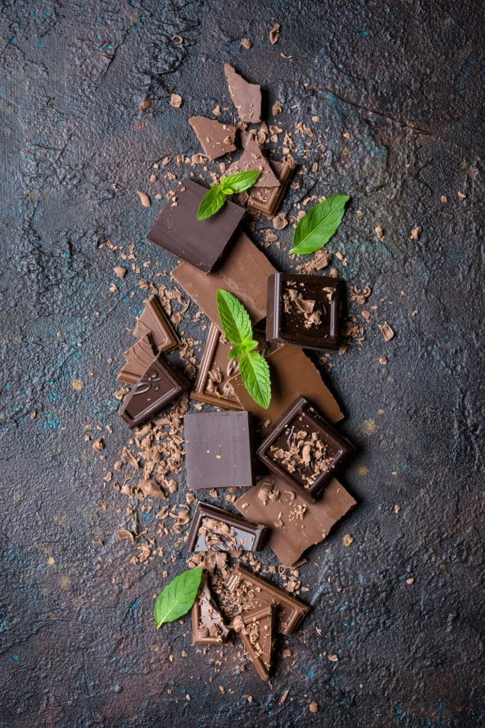 Squares of dark chocolate stacked together