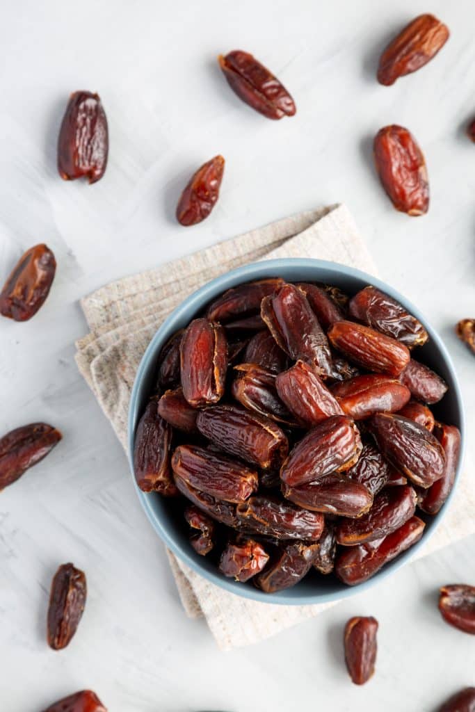 Pitted dates piled in a bowl