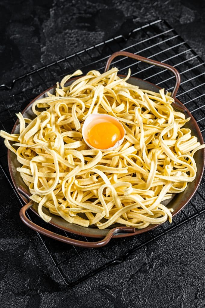 A bowl of cooked egg noodles ready to serve