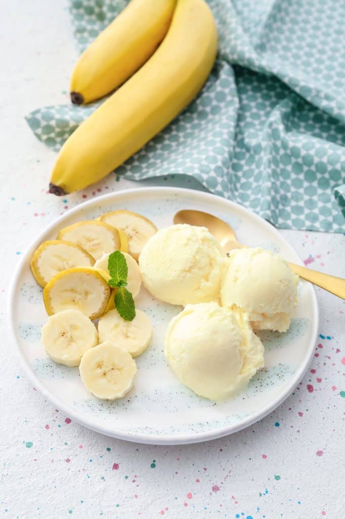 Frozen banana slices on a tray