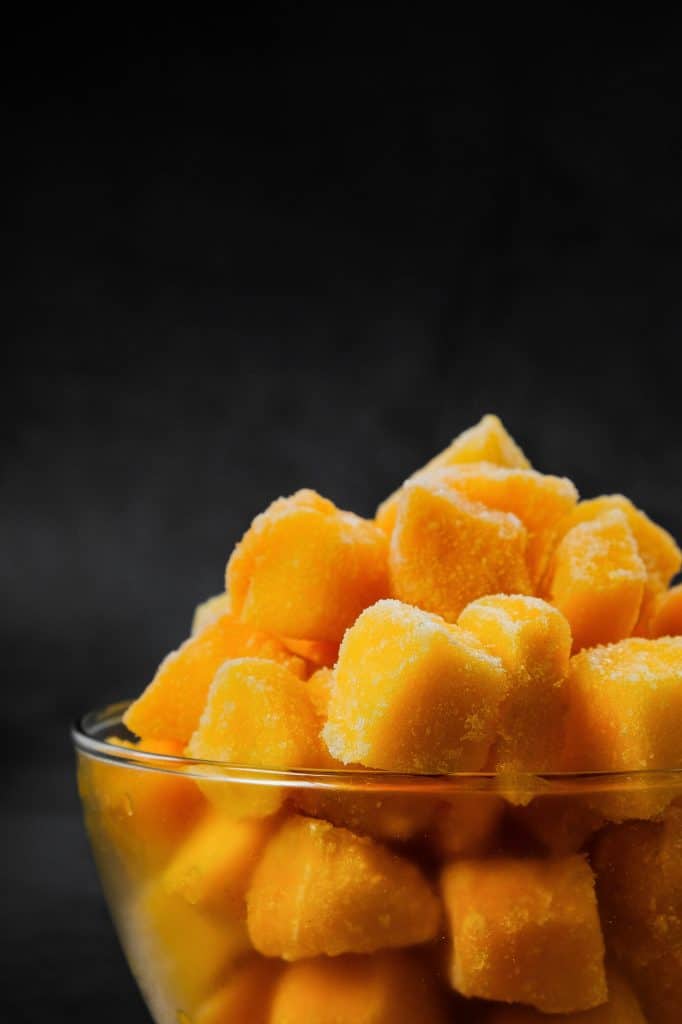 Frozen mango chunks in a bowl
