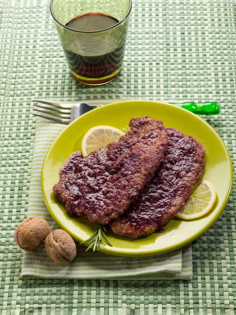 Delicious meat dish with wine and fresh lemon