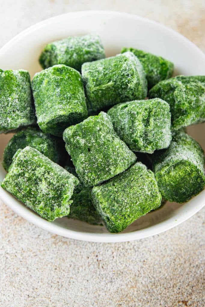A block of frozen chopped spinach