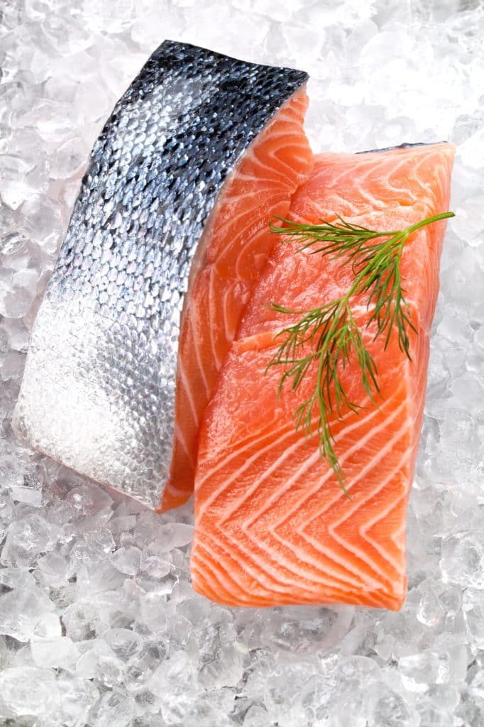 Frozen wild salmon fillets on ice