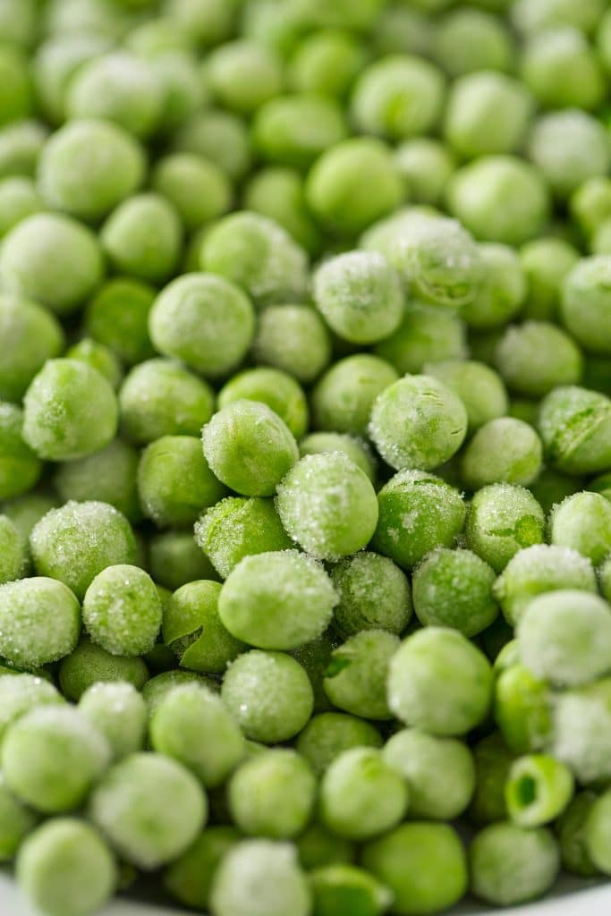Fresh green peas with a light frost
