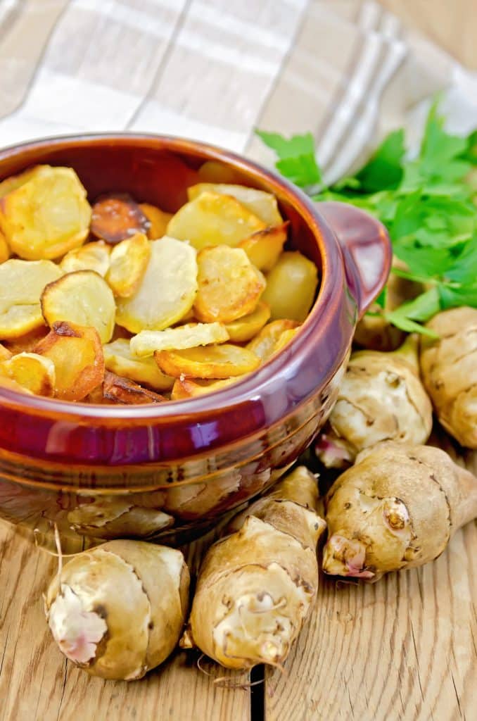 Jerusalem artichokes piled on a counter