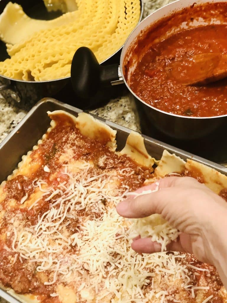 A slice of layered lasagna on a plate