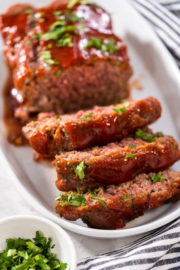 A sliced meatloaf with glaze