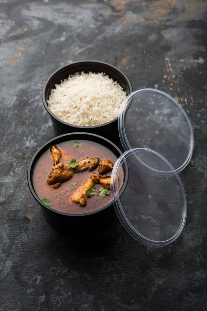 food in a plastic container ready to go in the microwave