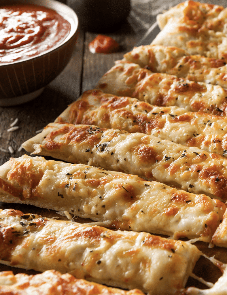 Pizza dippers and breadsticks on a plate