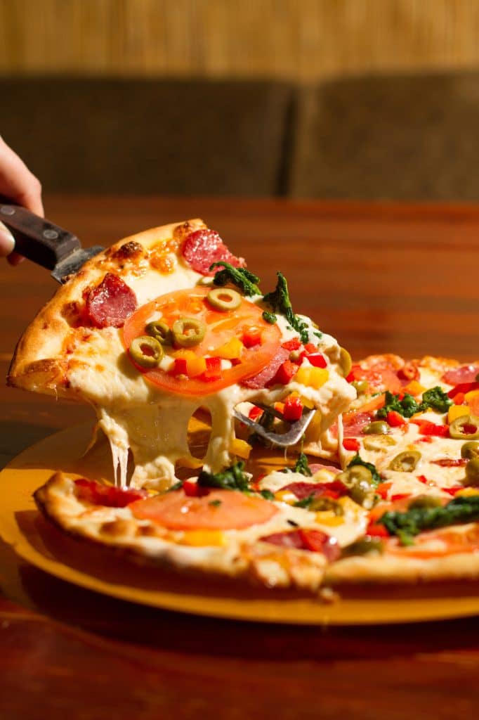 A whole baked pizza fresh out of the oven