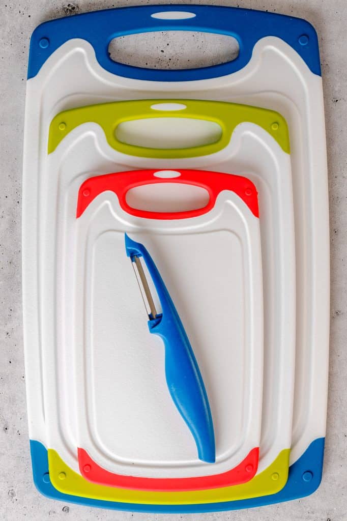 plastic cutting board sitting on a kitchen counter