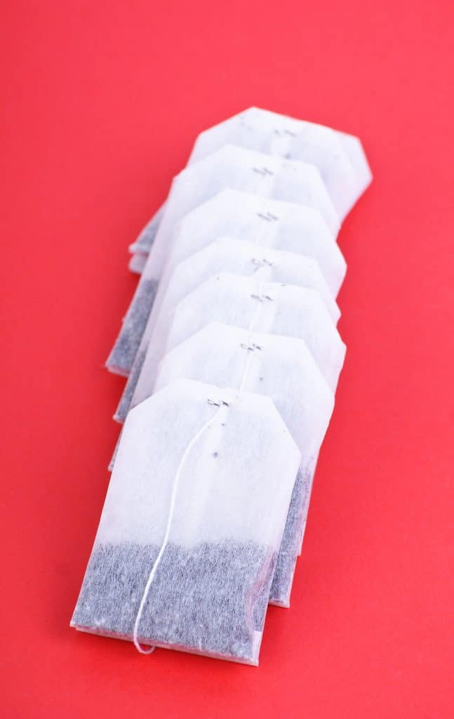 tea bags resting on a small saucer