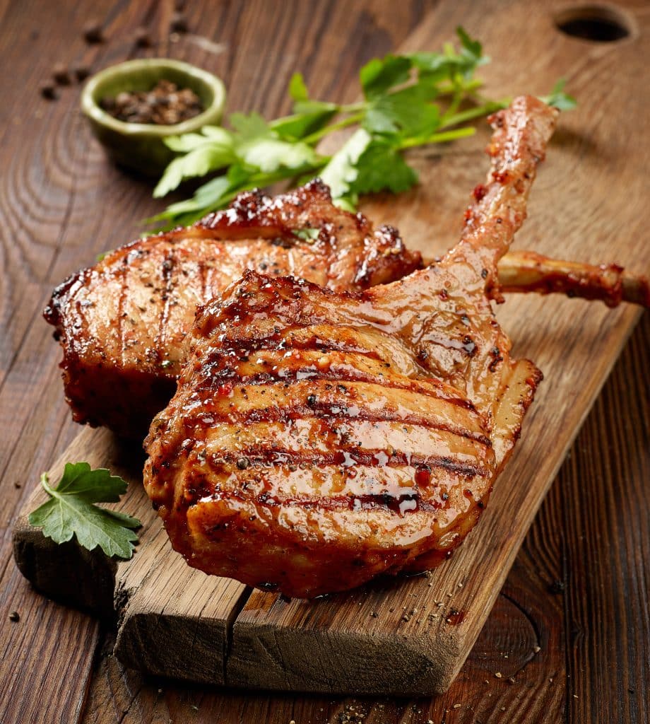 Pork chops served with applesauce