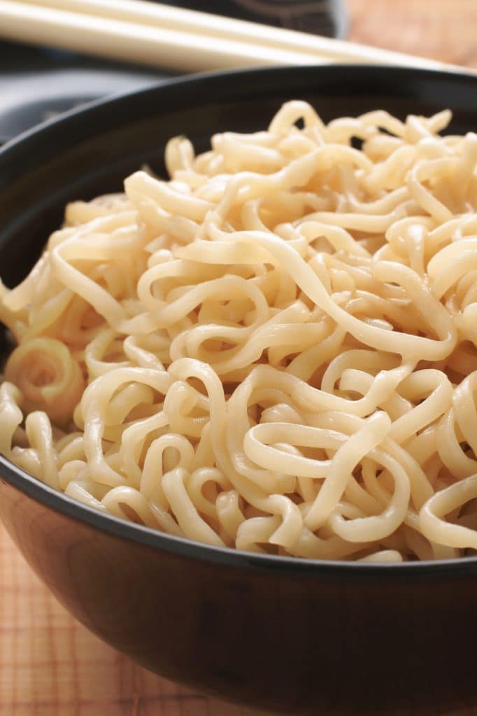 Instant ramen noodles in broth with chopsticks