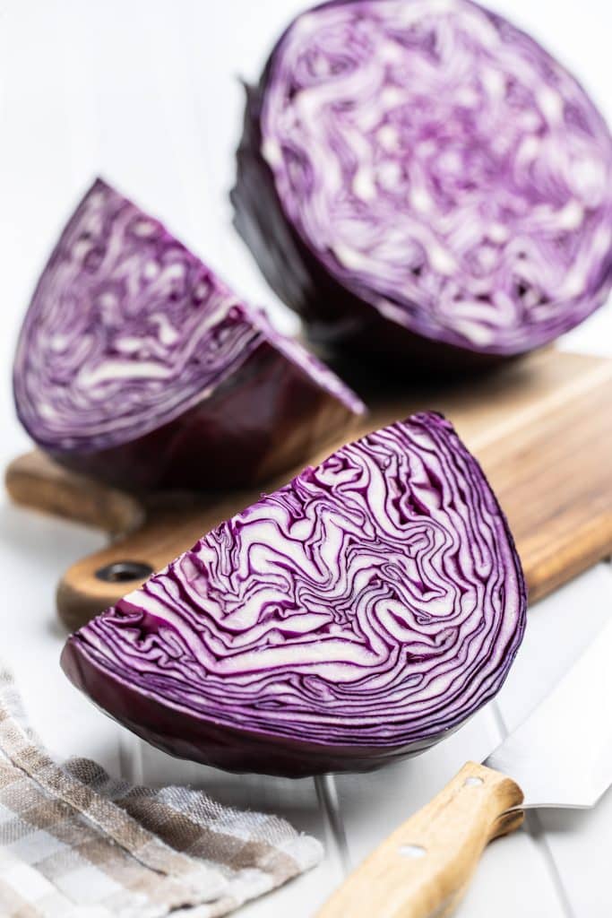 Sliced red cabbage on a wooden cutting board