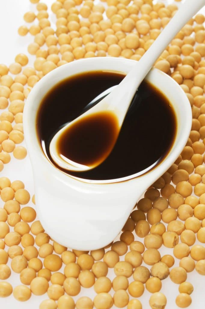 Bottle and bowl of dark soy sauce