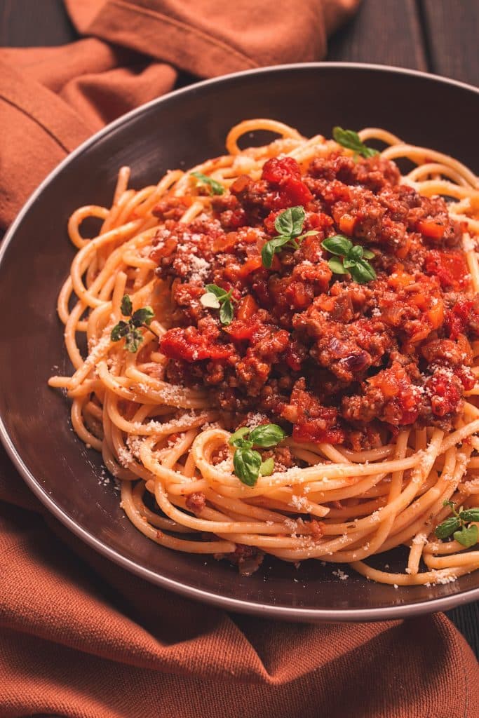 A plate of spaghetti with meat sauce