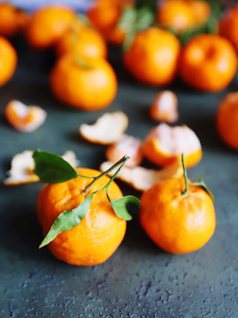 Whole tangerines with their peel still on
