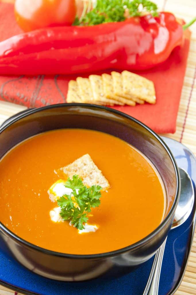 Tomato soup topped with crumbled crackers
