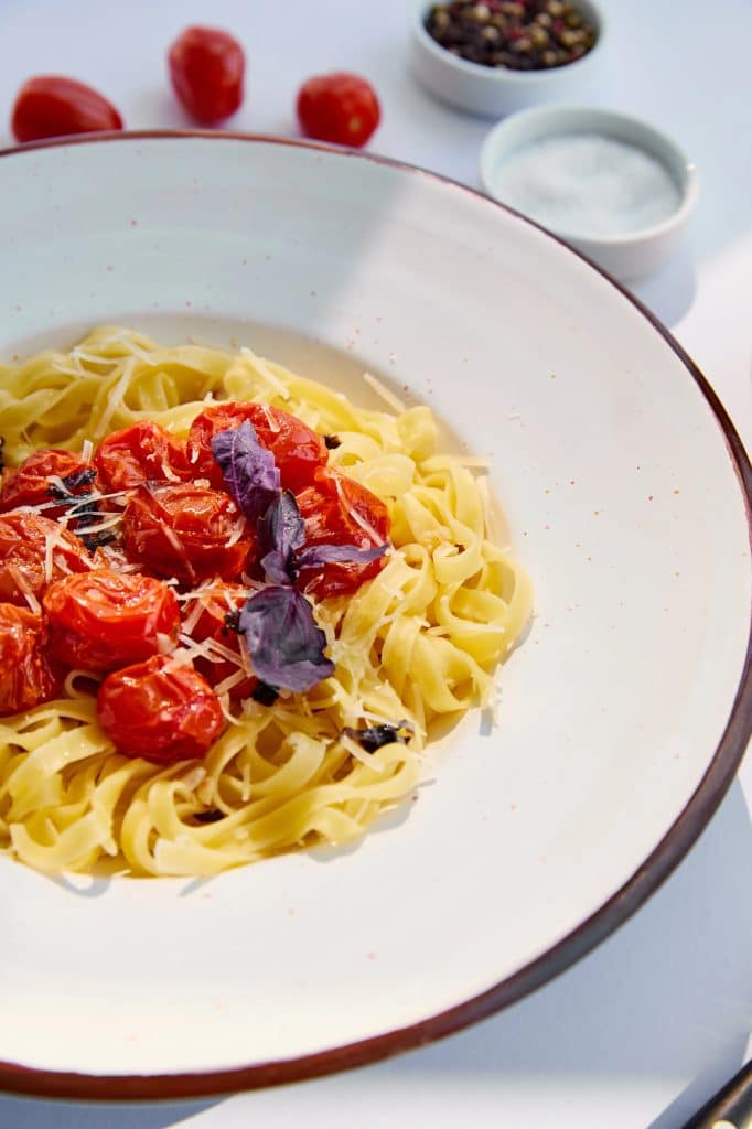 Tomatoes with a few soft spots piled in a bowl