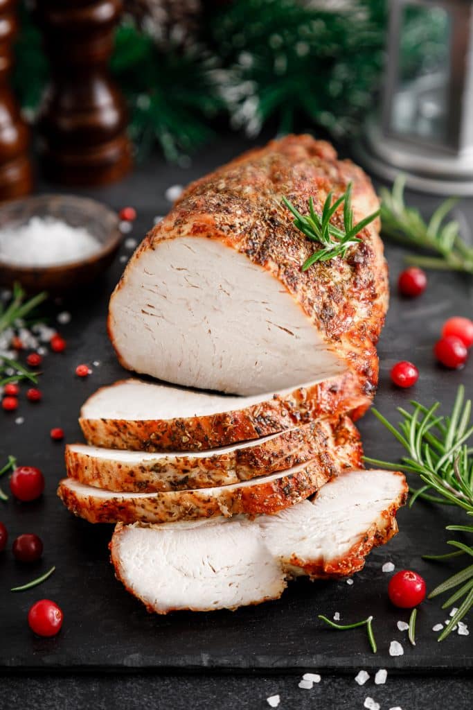 Golden roasted turkey on a festive dinner table