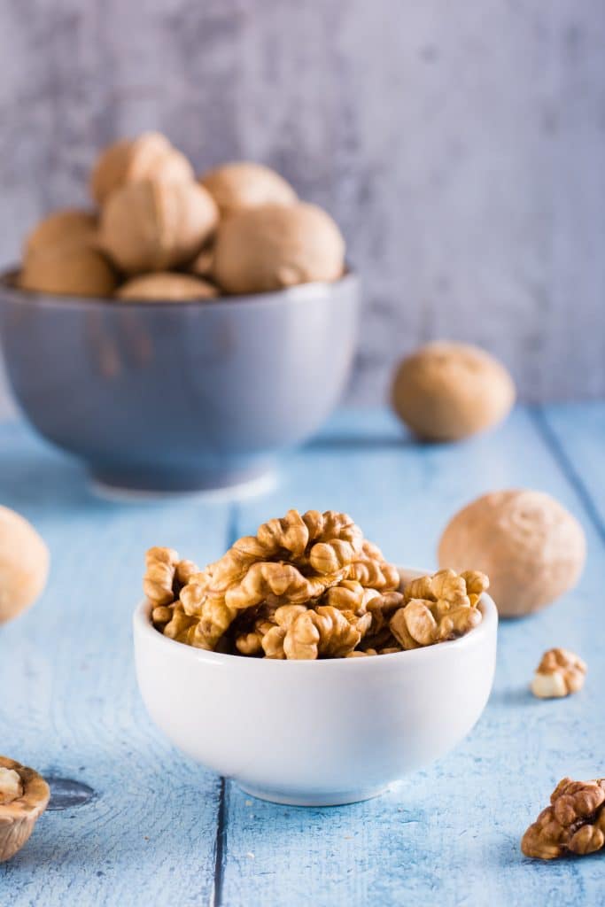 Peeled walnuts in a bowl on the table
