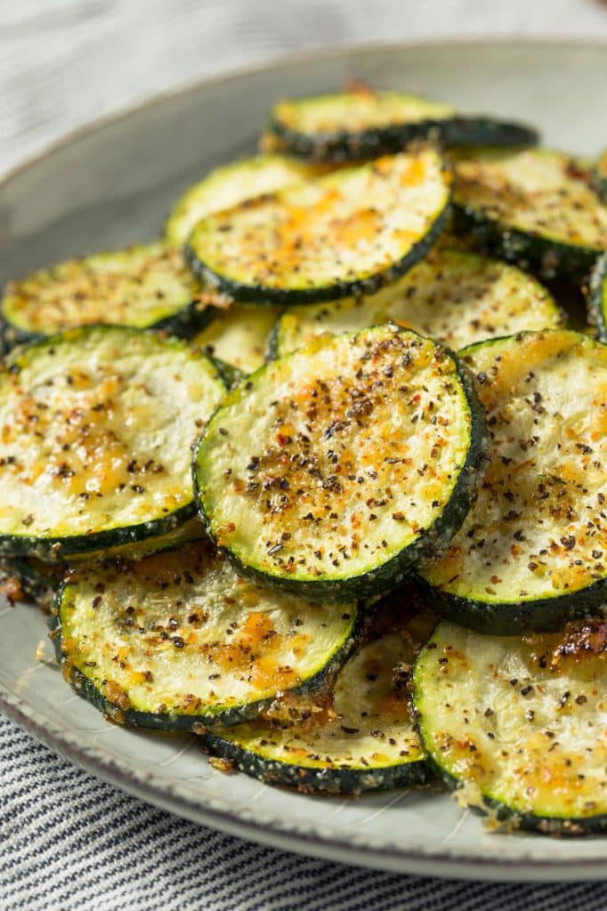 Fresh zucchini sliced on a cutting board